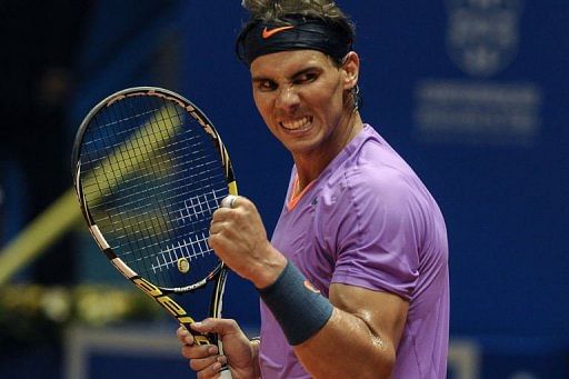 Spanish tennis player Rafael Nadal celebrates after winning his Brazil Open single match on February 14, 2013