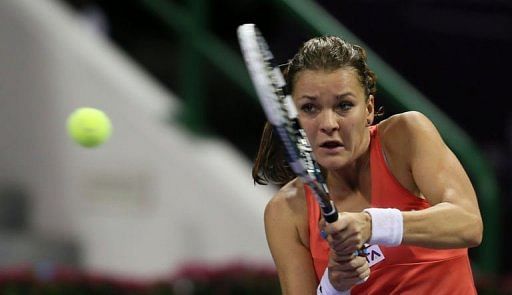 Agnieszka Radwanska of Poland returns the ball to Caroline Wozniacki of Denmark on February 15, 2013 in Doha