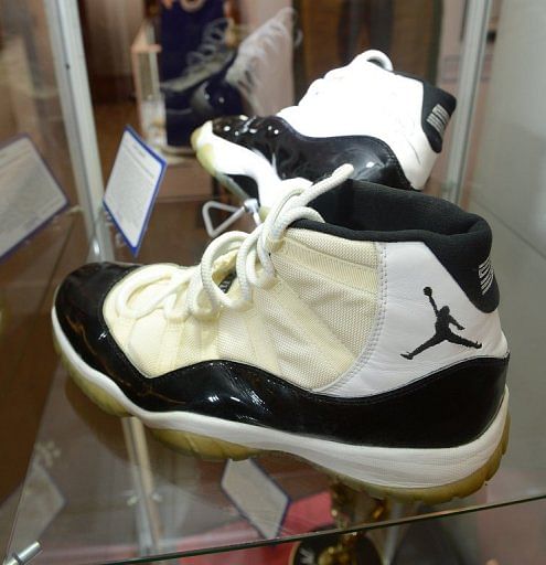 A pair of Air Jordan XI Concord basketball shoes, signed and game worn by basketball superstar Michael Jordan