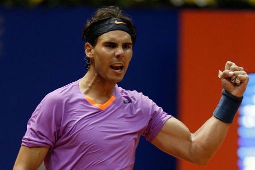 Spanish tennis player Rafael Nadal celebrates after defeating Argentinian Carlos Berlocq in Brazil, on February 15, 2013