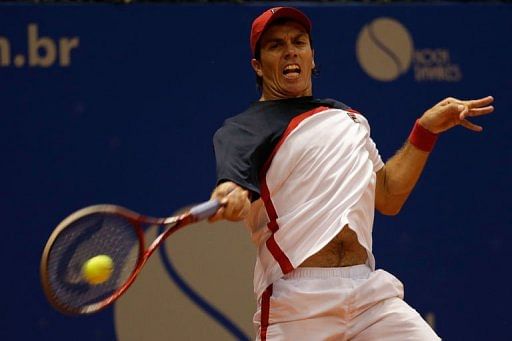 Carlos Berlocq returns a ball to Rafael Nadal during the Brazil Open in Sao Paulo, Brazil, on February 15, 2013