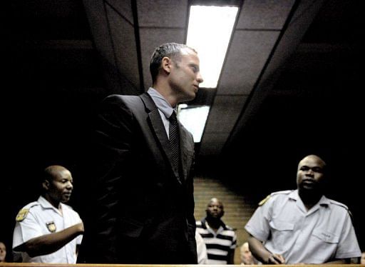 Oscar Pistorius leaves the court room on February 15, 2013 at the Magistrate Court in Pretoria