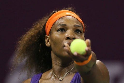 Serena Williams  serves to Petra Kvitova during their WTA Qatar Open quarter-final match on February 15, 2013 in Doha