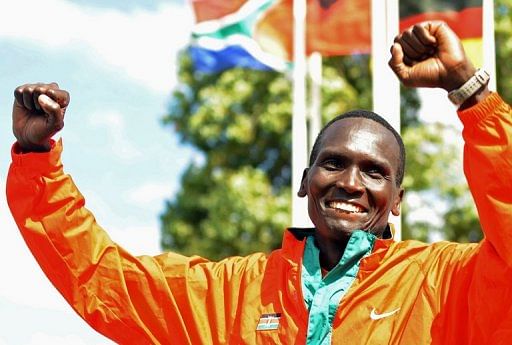 Kenyan Paul Tergat celebrates on the podium in Lisbon on September 28, 2008