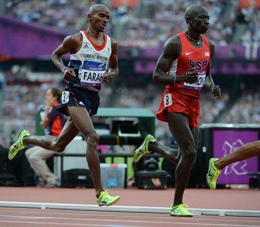 Lopez Lomong (R) is pictured with Britain&#039;s Mohamed Farah on August 11, 2012 during a London Olympics athletics event
