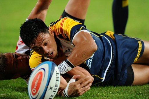 ACT Brumbies flyhalf Christian Lealiifano is tackled during a Super 15 rugby match in Johannesburg on April 27, 2012