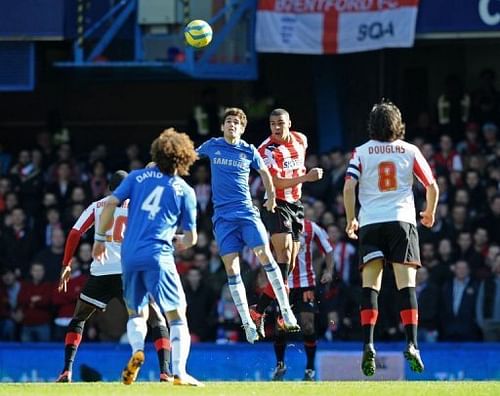 Chelsea's Oscar (centre) vies with Brentford defender Shaleum Logan on February 17, 2013 Chelsea's Oscar (centre) vies with Brentford defender Shaleum Logan on February 17, 2013