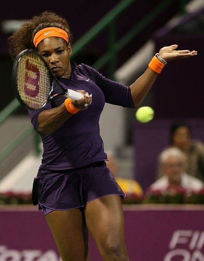 Serena Williams returns the ball in Doha on February 17, 2013