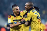 Sochaux' Cedric Bakambu (R) is congratulated by Ryad Boudebouz (L) in Montbeliard on February 17, 2013