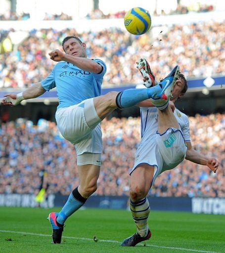 Leeds United&#039;s Stephen Warnock (R) vies with Manchester City&#039;s James Milner in Manchester on February 17, 2013