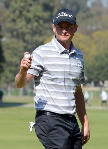 John Merrick celebrates a birdie during the final round of the Northern Trust Open on February 17, 2013