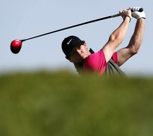 Rory McIlroy plays a shot during the first round in Abu Dhabi on January 17, 2013