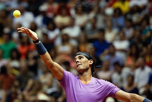 Spanish tennis player Rafael Nadal serves during the Brazil Open single final match in Sao Paulo on February 17, 2013