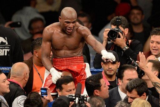 Floyd Mayweather Jr. celebrates after defeating Miguel Cotto on May 5, 2012 in Las Vegas, Nevada