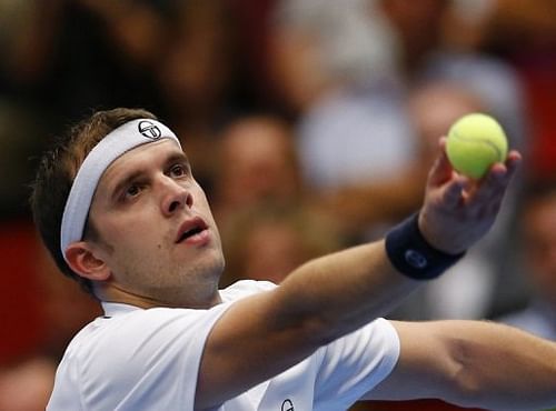 Luxembourg's Gilles Muller serves in Vienna, on October 20, 2012