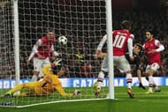 Bayern Munich's Thomas Muller (2nd R) scores in north London on February 19, 2013