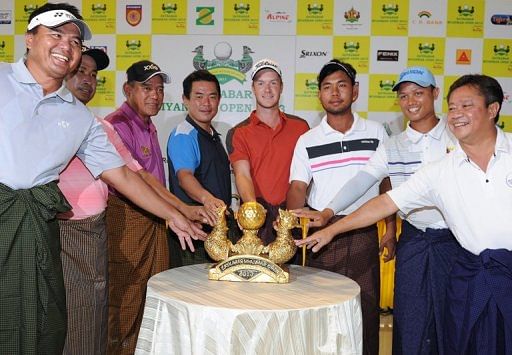Players gather at the Royal Mingalardon Golf and Country Club in Yangon, on February 19, 2013