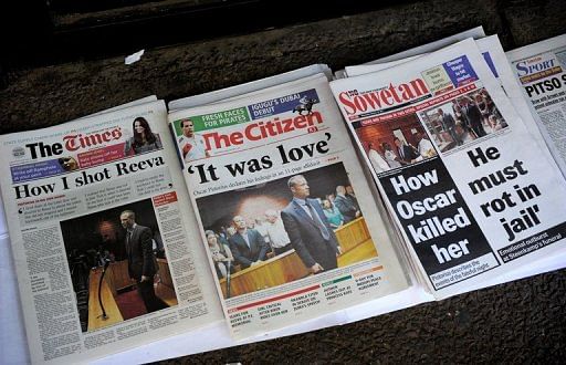 Front pages of South African newspapers featuring sprinter Oscar Pistorius are displayed on February 20, 2013