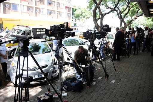 Media wait on February 20, 2013, outside the Magistrate Court in Pretoria during Oscar Pistorius&#039;s bail hearing