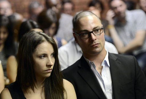 The brother and sister of Oscar Pistorius, Aimee (L) and Carl, on February 20, 2013, at the Magistrate Court in Pretoria