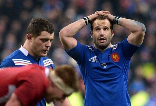 Fly-half Frederic Michalak holds his head in his hands as France lost to Wales on February 9, 2013