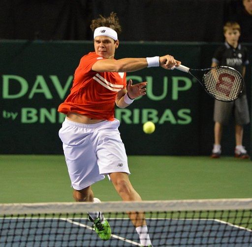 Milos Raonic plays a return during a Davis Cup tie in Vancouver on February 1, 2013