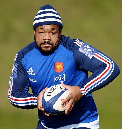 Mathieu Bastareaud runs with a ball at a training session in Marcoussis, south of Paris, on February 21, 2013