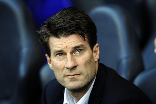Michael Laudrup looks on at White Hart Lane in north London on December 16, 2012