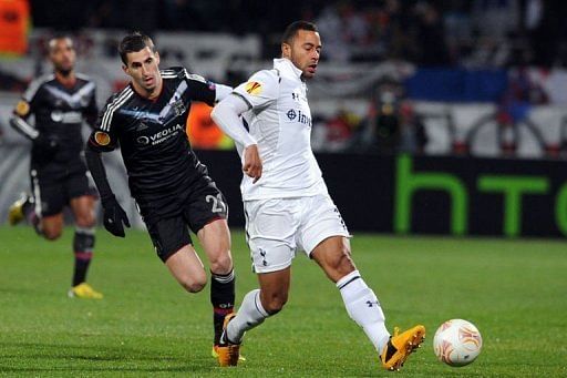 Totthenam&#039;s Moussa Dembele (L) clashes with Lyon&#039;s Maxime Gonalons on Febuary 21, 2013 at the Gerland stadium in Lyon