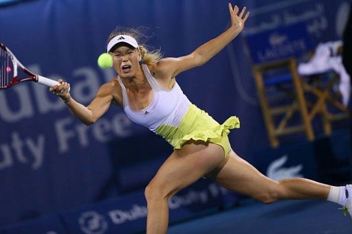 Caroline Wozniacki hits a return in Dubai on February 21, 2013