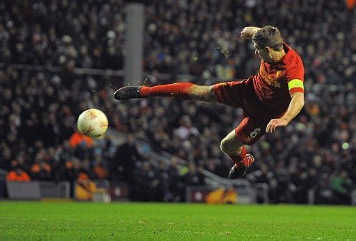 Liverpool&#039;s midfielder Steven Gerrard shoots in Liverpool on February 21, 2013