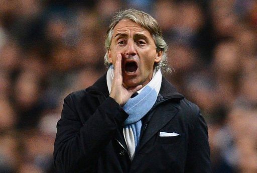 Roberto Mancini watches Manchester City play Ajax at The Etihad Stadium on November 6, 2012