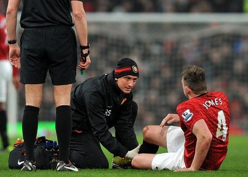 Phil Jones gets treatment before being substituted during the FA Cup match at home to Reading on February 18, 2013