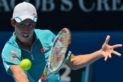 Kei Nishikori hits a return to David Ferrer during their match at the Australian Open on January 20, 2013