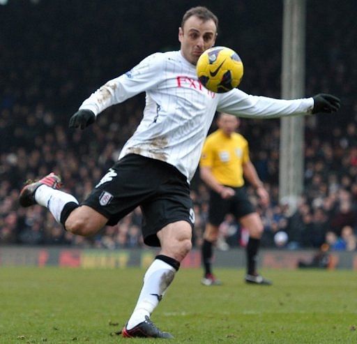 Berbatov's magic moment sinks Stoke