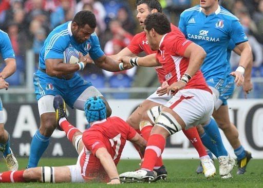 Italy&#039;s Alessandro Zanni (L) is tackled by Justin Tipuric of Wales (C) at the Olympic Stadium on February 23, 2013