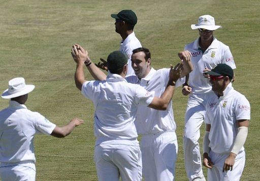South Africa bowler Kyle Abbott (C) celebrates a dismissal at Super Sport Park in Centurion on February 23, 2013