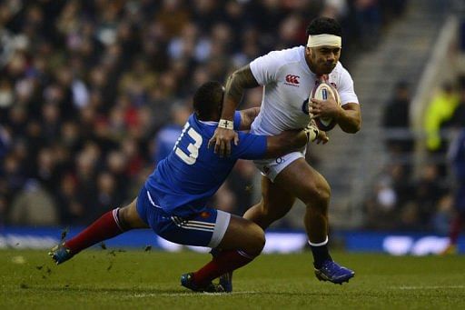 England&#039;s Manu Tuilagi (R) gets tackled by France&#039;s Mathieu Bastareaud at Twickenham Stadium on February 23, 2013