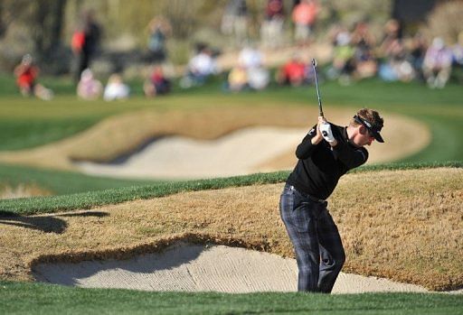 Ian Poulter plays his way out of a bunker in the quarter-finals of the WGC Match Play Championship on February 23, 2013