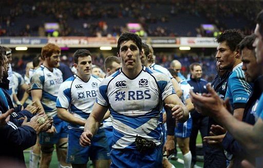 Kelly Brown of Scotland leads his team from the field after their match against Italy, in Edinburgh, on February 9, 2013