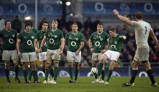 Ireland&#039;s Ronan O&#039;Gara (2nd R) kicks the ball toward the touchline, in Dublin, on February 10, 2013