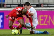 Marseille's English midfielder Joey Barton (R) tangles with Nancy forward Djamel Bakar on February 3, 2013