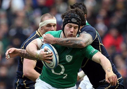 Sean O&#039;Brien of Ireland (left) is tackled by Jim Hamilton of Scotland (right)