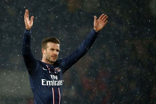 Paris Saint-Germain&#039;s David Beckham waves on February 24, 2013 at the Parc des Princes stadium in Paris