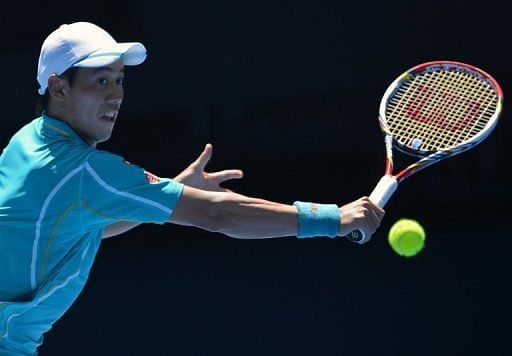 Kei Nishikori hits a return on day seven of the Australian Open tennis tournament in Melbourne on January 20, 2013