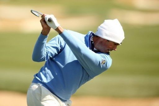 Matt Kuchar hits an apporach shot on the eighth hole on February 24, 2013 in Marana, Arizona