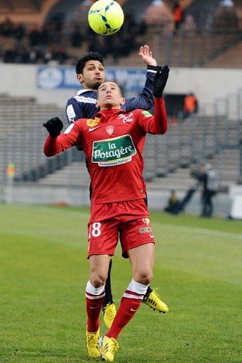 Bordeaux&#039;s Benoit Tremoulinas and Brest&#039;s Florian Raspentino go head to head on February 24, 2013 in Bordeaux