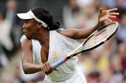 Venus Williams hits a forehand during a singles match at the Wimbledon Tennis Championships on June 22, 2011
