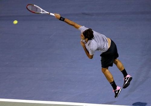 Roger Federer serves to Malek Jaziri in Dubai on February 25, 2013