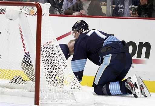 Evgeni Malkin of the Pittsburgh Penguins is tended to by medical staff on February 22, 2013 in Pittsburgh, Pennsylvania